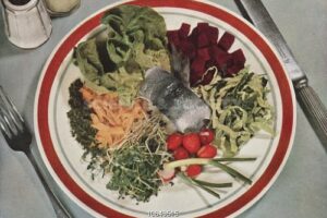 Plate with fish surrounded by vegetables, 1941